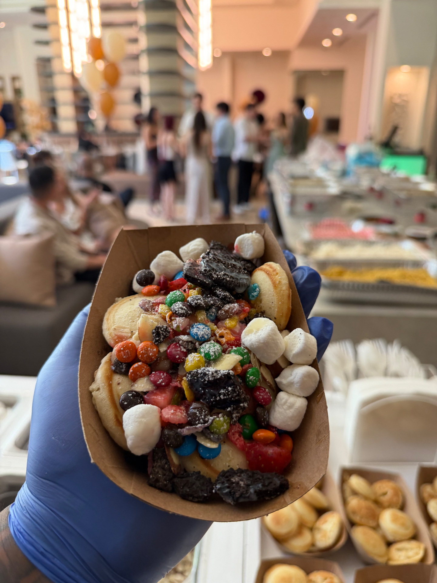 Loaded mini pancakes with fruit, candy, cookies, and marshmallows