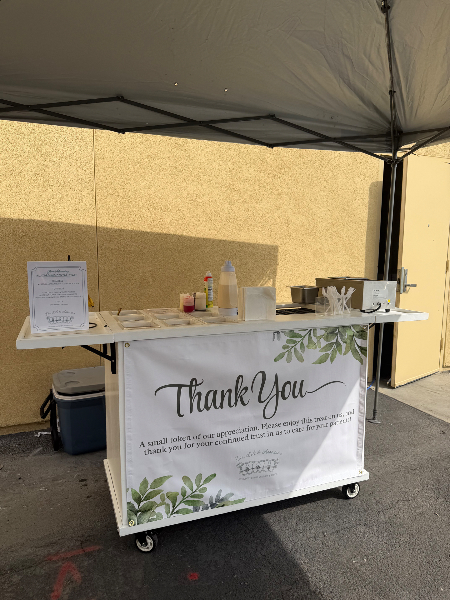 A Firme Stacks and Crepes mobile cart prepared under a canopy