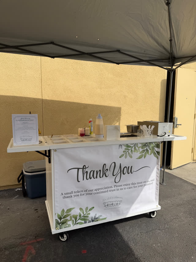 A Firme Stacks and Crepes mobile cart prepared under a canopy